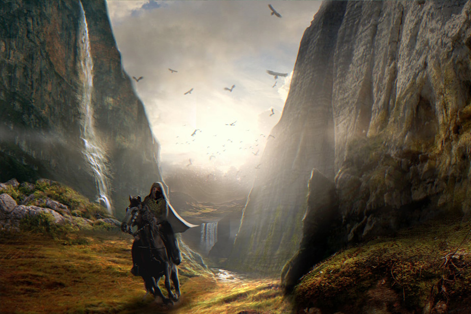 En ryttare rider genom ett bergspass.